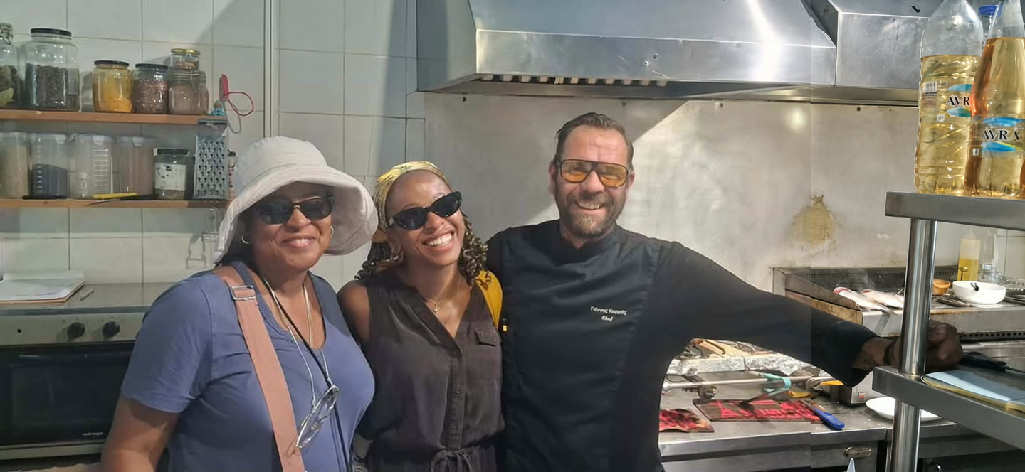 Three people smiling together inside the Lombranos kitchen.